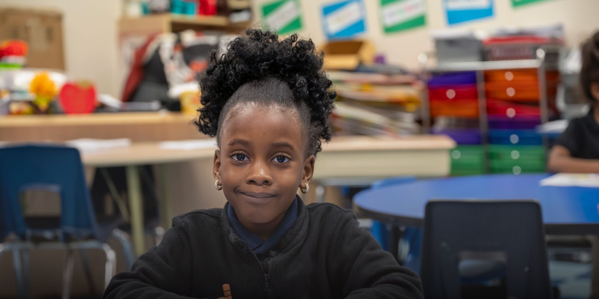 Smiling student working at desk