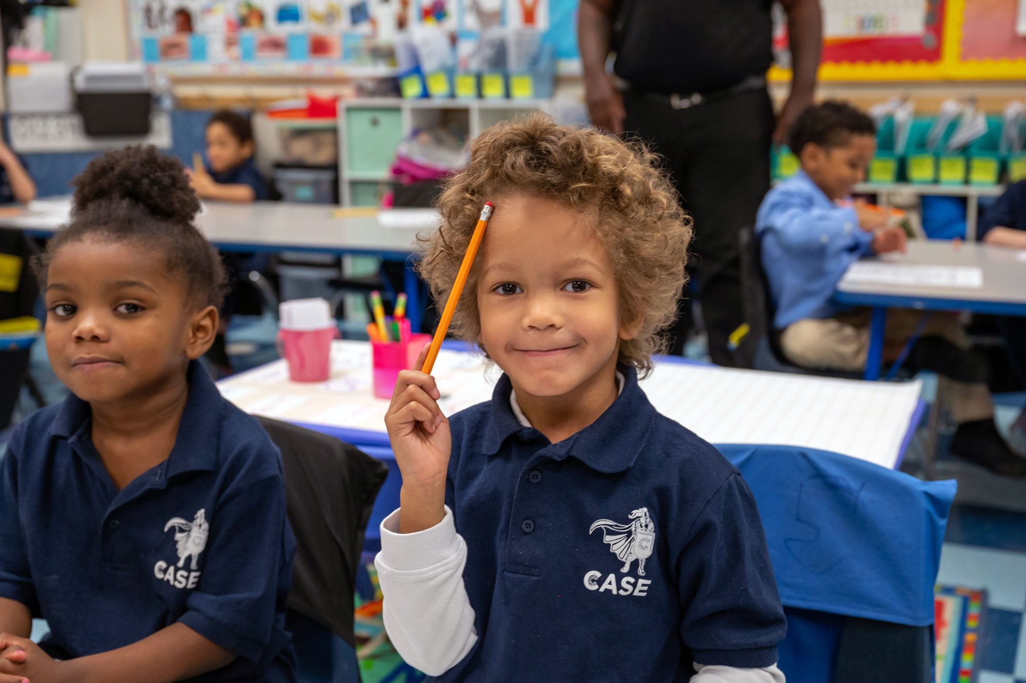 Smiling elementary student working at desk